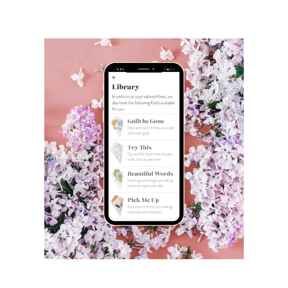 Phone displaying the Kite for Mums app on a floral background